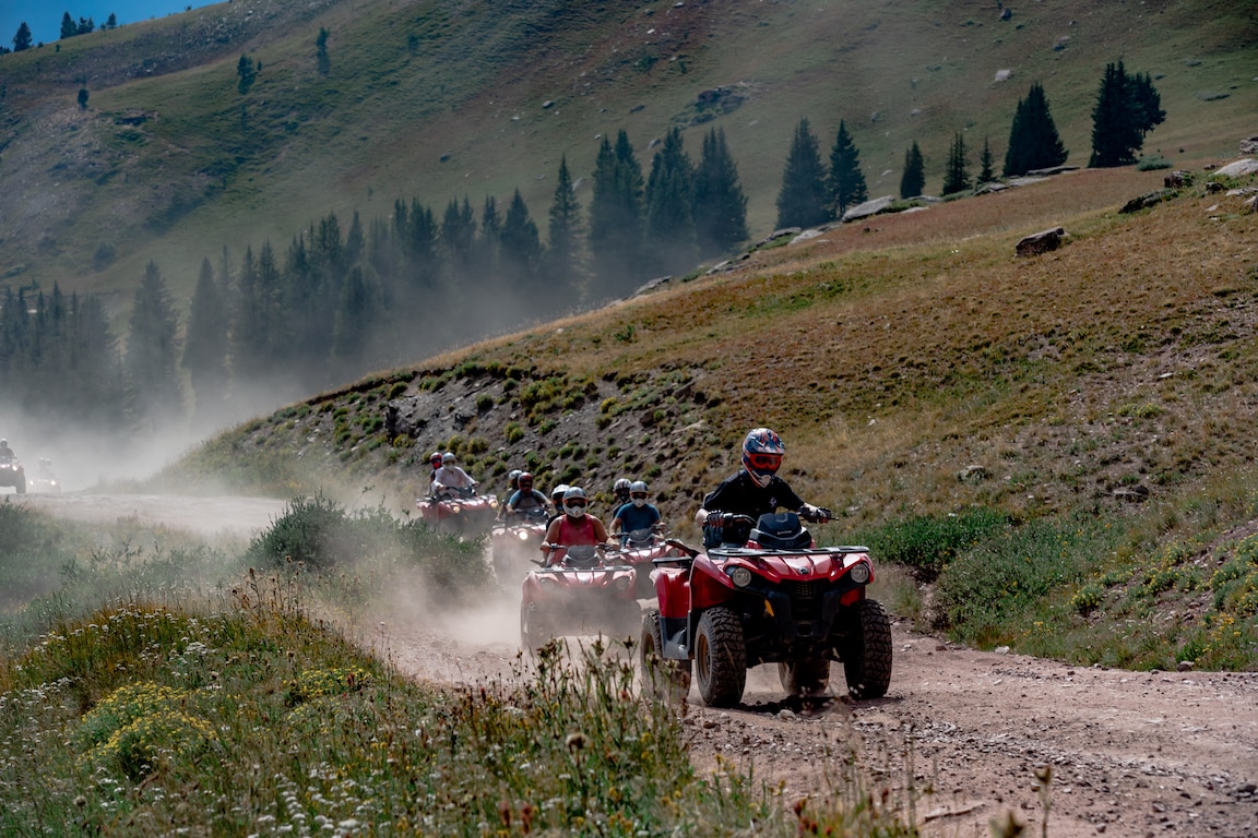 Two Can-am riding in a mountain trail in Colorado