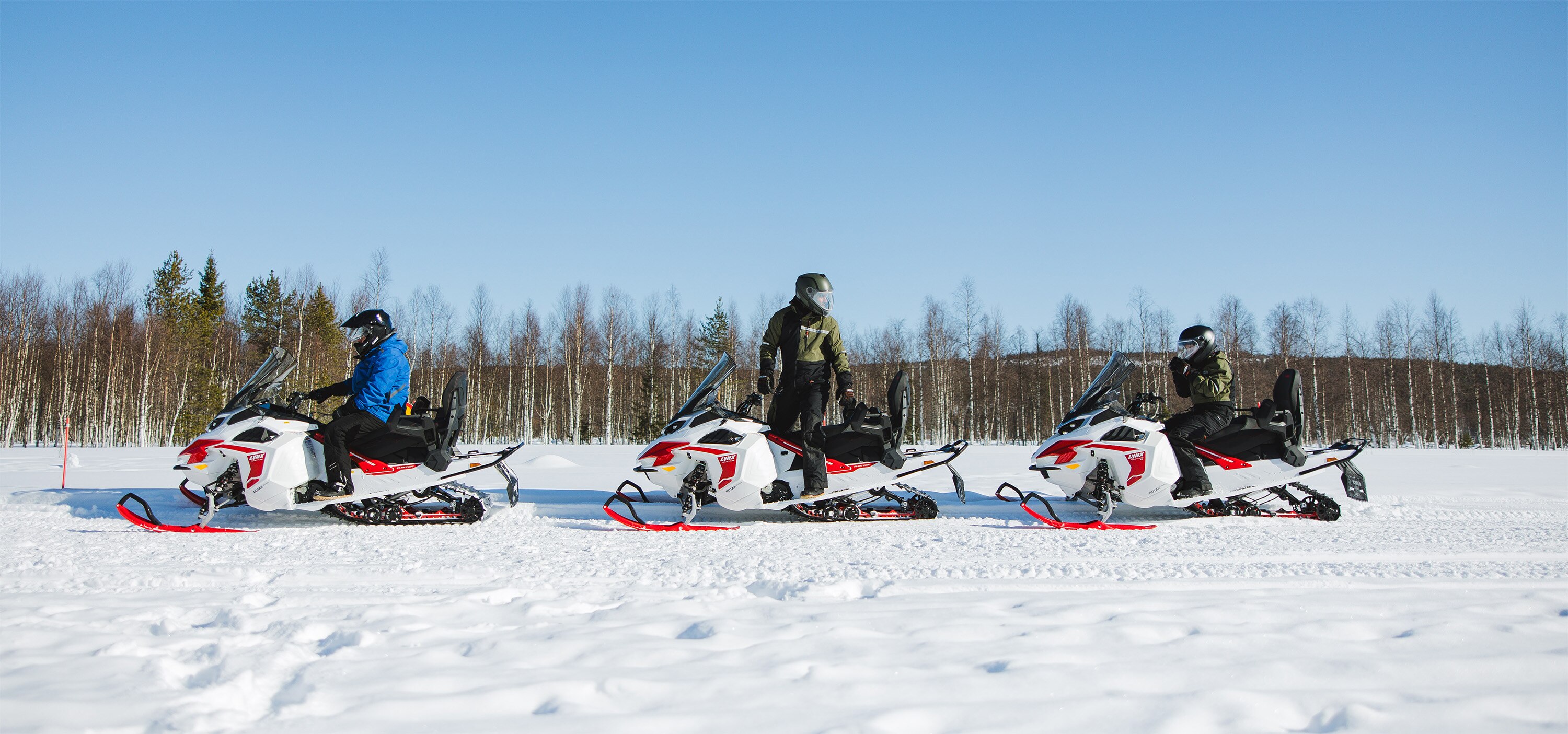 Electric Ski-Doo Grand Touring snowmobile in action in Lapland