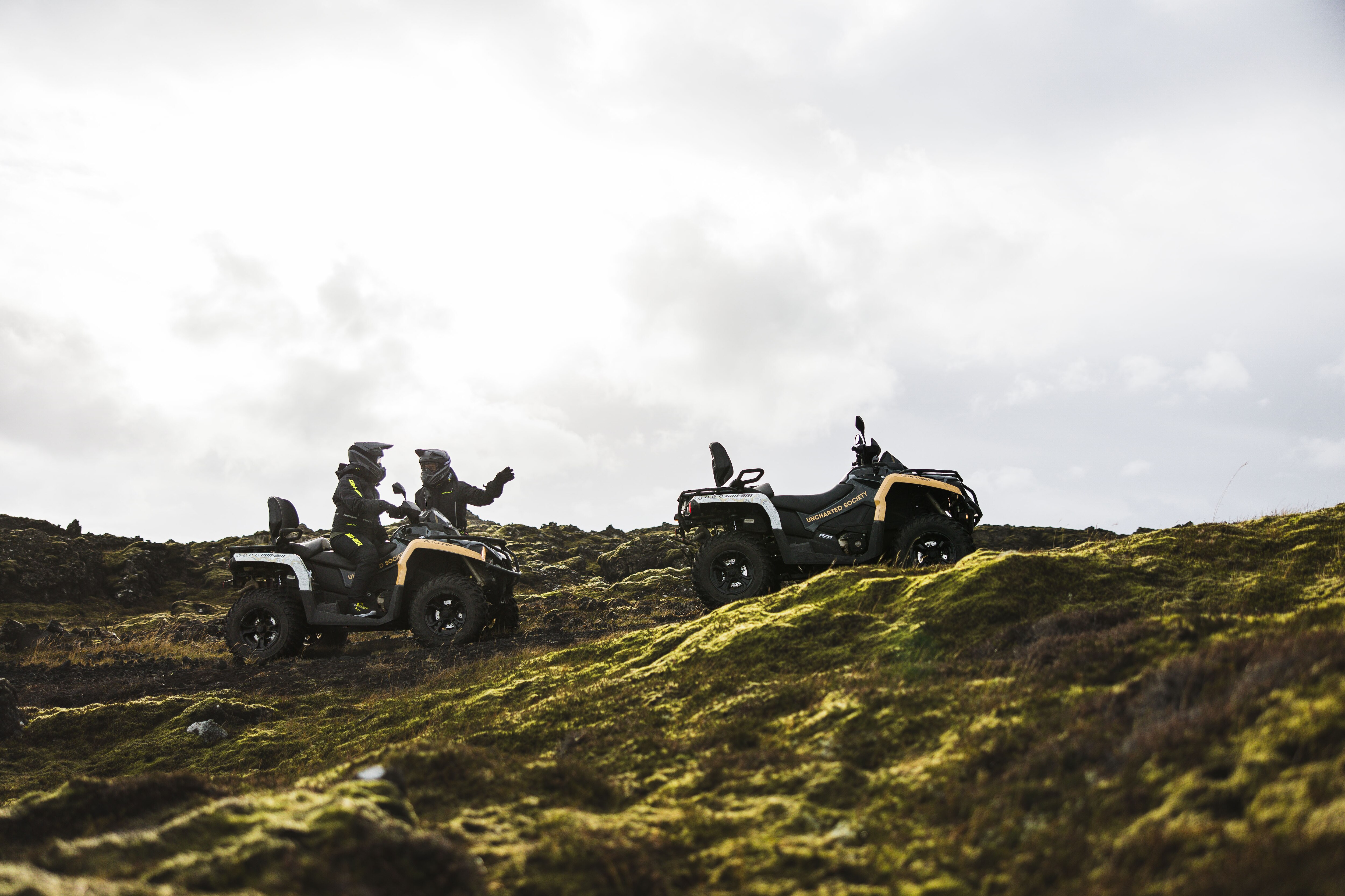 Two friends exploring Iceland mountains with their ATV's