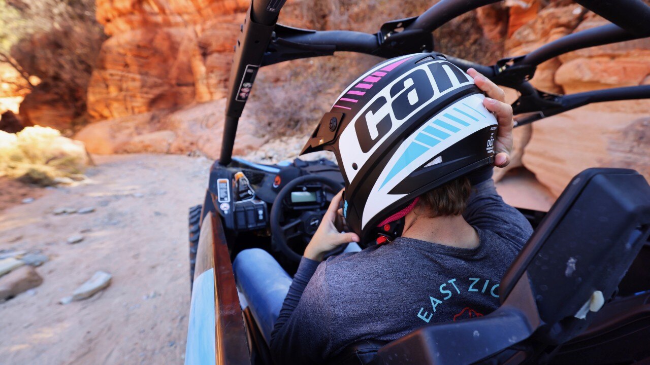 Action shot of Can-Am rider in red rocks